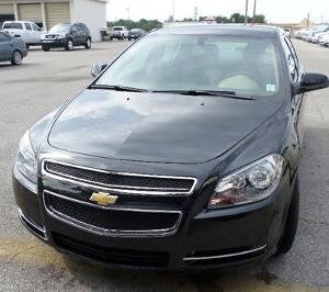 Black Chevrolet front hood after repair