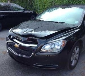 Black Chevrolet recked in front hood